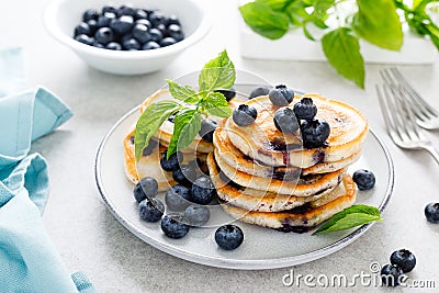 Blueberry pancakes with fresh berries on breakfast table Stock Photo