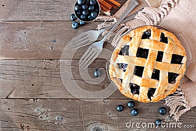 Blueberry pie, top view corner border over a rustic wood background Stock Photo