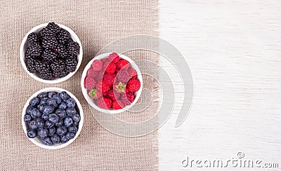 Blueberry raspberry blackberry in white bowl. Berries Copy space. Top view Stock Photo