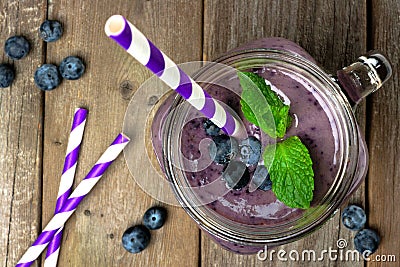 Blueberry smoothie with mint in mason jar above view Stock Photo