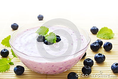 Blueberry yogurt in bowl Stock Photo