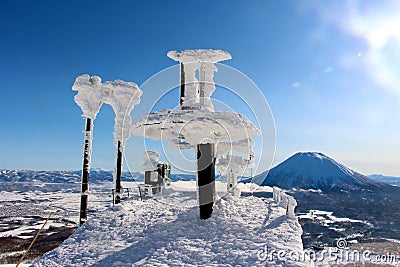 A bluebird day at Hanazono frozen chairlift station Stock Photo