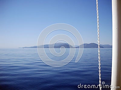 When blueness of seascape meets whiteness of boat Stock Photo