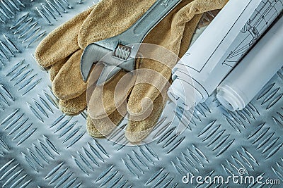 Blueprints adjustable spanner safety gloves on channeled metal s Stock Photo