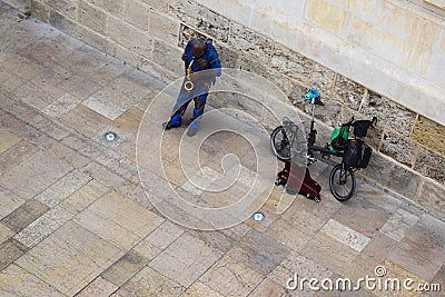 Blues busker playing sax in Seville Editorial Stock Photo