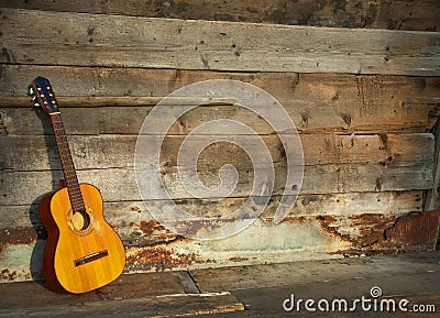 Blues guitar the old wooden wall as background Stock Photo