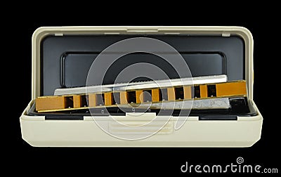 Blues Harp & Case isolated on black background Stock Photo