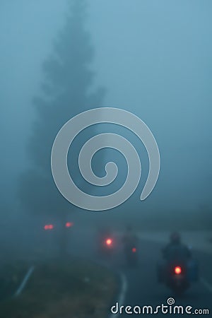 Blur the atmosphere of the foggy road, there are several motorbikes Stock Photo