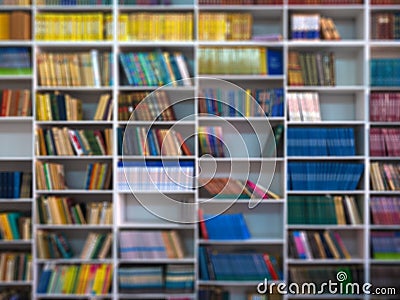 Blur books on wooden bookshelf in university or public library room or book store, abstract blur background.concept for education Stock Photo