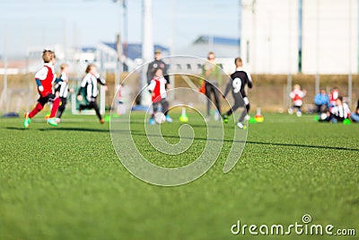 Blur of boys playing soccer Stock Photo