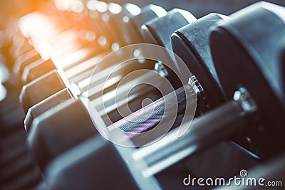 Blur Equipment And Machines At The Empty Modern Gym Room. Fitness Center. Toned image. Stock Photo