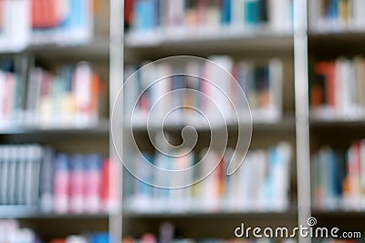 Blur image of shelf with books in library. Background Stock Photo