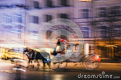 Blur motion of horse-drawn carriage in the city road Stock Photo