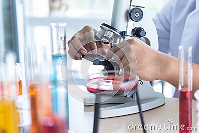 Blur soft images of the Scientist Using a microscope For product inspection Stock Photo