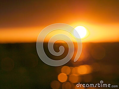 Blur sunset over lake with bokeh sun light. Stock Photo