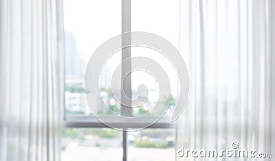 Blur of white curtain on window with city view background Stock Photo