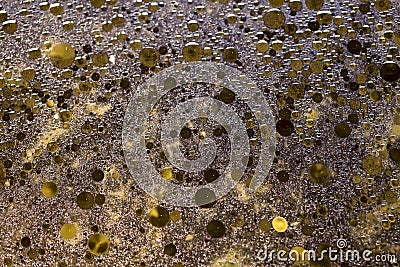 Blurred abstract background of the texture of the liquid with brown drops of oil. Stock Photo