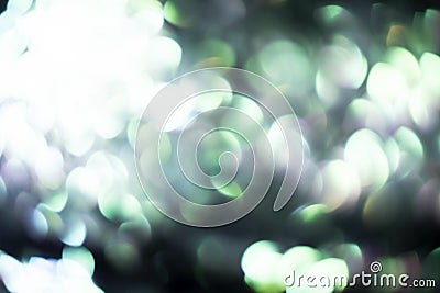 Blurred abstract black background with green and gray lights Stock Photo