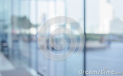 Blurred abstract glass wall from building in city town Stock Photo