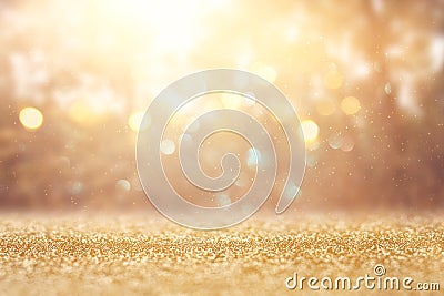 blurred abstract photo of light burst among trees and glitter golden bokeh lights. Stock Photo