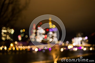 Blurred background of bright view on the night city and skyscraper. Stock Photo