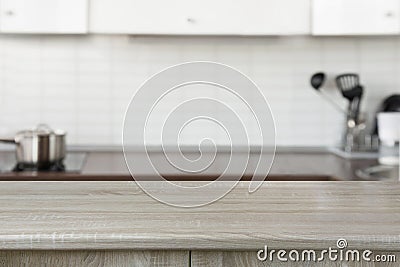 Blurred background. Modern defocused pastel kitchen with empty tabletop and space. Stock Photo
