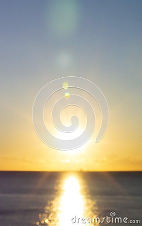 Blurred background. Sun shining in sky during sunset dawn. Sunrise dawning Stock Photo