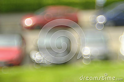 Blurred background with vintage bokeh bubble balls, shot with a vintage lens.Line of cars in a street, free copy space Stock Photo