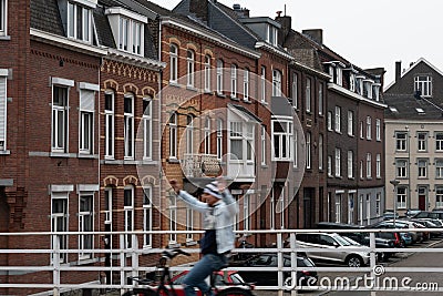 Blurred biker on Maastricht street Editorial Stock Photo