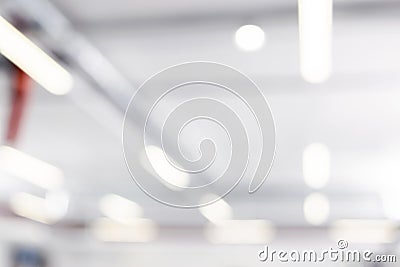 Blurred business background. Blur warehouse with bokeh light background. Blurred background Lights and ventilation system in long Stock Photo