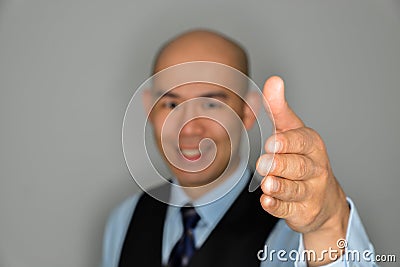 Blurred Businessman Offering Clear Handshake And Smile Stock Photo