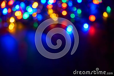 Blurred christmas lights on dark background Stock Photo