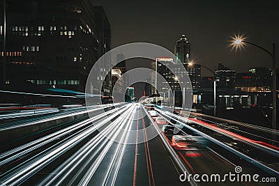 Blurred city lights and vehicles depict urban hustle and bustle Stock Photo