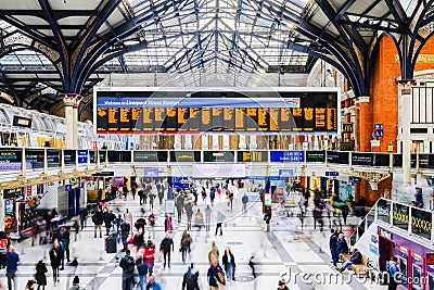Blurred commuters moving through concourse of Liverpool Street Station Editorial Stock Photo