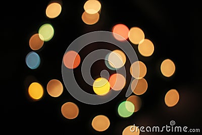 Blurred defocused christmas light lights bokeh background. Colorful red yellow blue green de focused glittering pattern Stock Photo