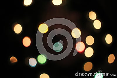 Blurred defocused christmas light lights bokeh background. Colorful red yellow blue green de focused glittering pattern Stock Photo