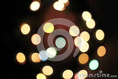 Blurred defocused christmas light lights bokeh background. Colorful red yellow blue green de focused glittering pattern Stock Photo