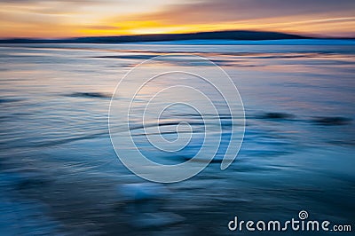 Blurred effect of the sea and sunset. Intentional camera movement creating a dreamy background. Stock Photo