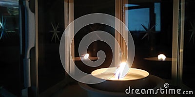 Blurred fire background. Burning candle closeup Stock Photo