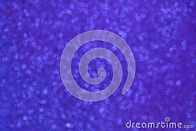 Blurred glittery texture of glitter in purple blue. Abstract Bokeh background. Stock Photo