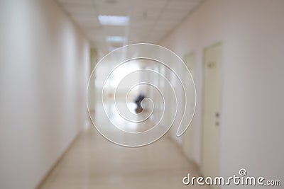 Blurred hospital indoor corridor hallway as background for graphic pursuit Stock Photo