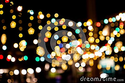 Blurred image Decorative outdoor string lights hanging in the garden at night time festivals season Stock Photo