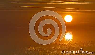 Blurred image of reflections of sun light on a water surface with absolute tranquillity - Soft focus Stock Photo