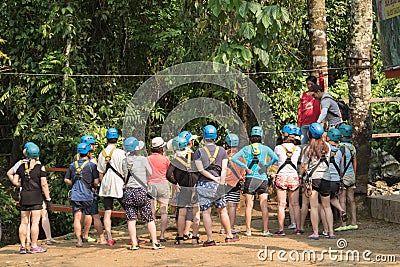 Blurred image of Visitors listen to the Tourist Guide before playing a zip-line. Editorial Stock Photo