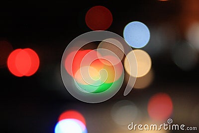 Blurred images of traffic lights at night with lots of bokeh and circles and colorful colors Stock Photo