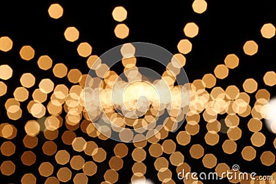 Blurred lines from circles golden and white colors on black background. Stock Photo