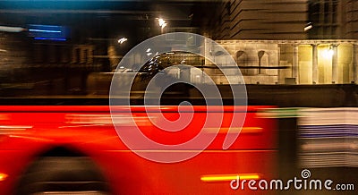 Blurred London bus at night Stock Photo