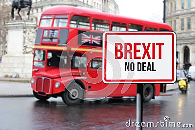Blurred London street view with red double decker bus and Brexit no deal sign in rainy day. Possible exit of Great Stock Photo