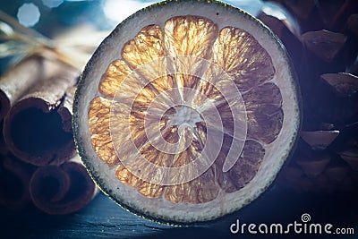 Blurred macro dried orange and cinnamon sticks Stock Photo