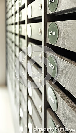 Blurred Mail boxes filled of leaflets and letters, Mailboxes and Lock Stock Photo